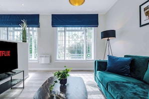 TV, offices - Contemporary 1BR Gem | Elysée Suites, Southport (Southport)