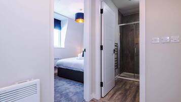 Shower, hair dryer, towels, shampoo