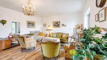 Family Apartment, 2 Bedrooms, 2 Bathrooms, Mountainside (Villa Salamander Suite - Garden & EV) | Living area | Flat-screen TV, stereo