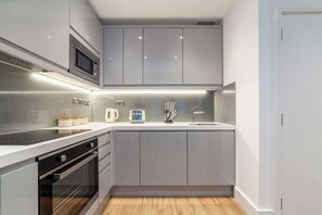 Apartment | Private kitchen | Electric kettle, highchair