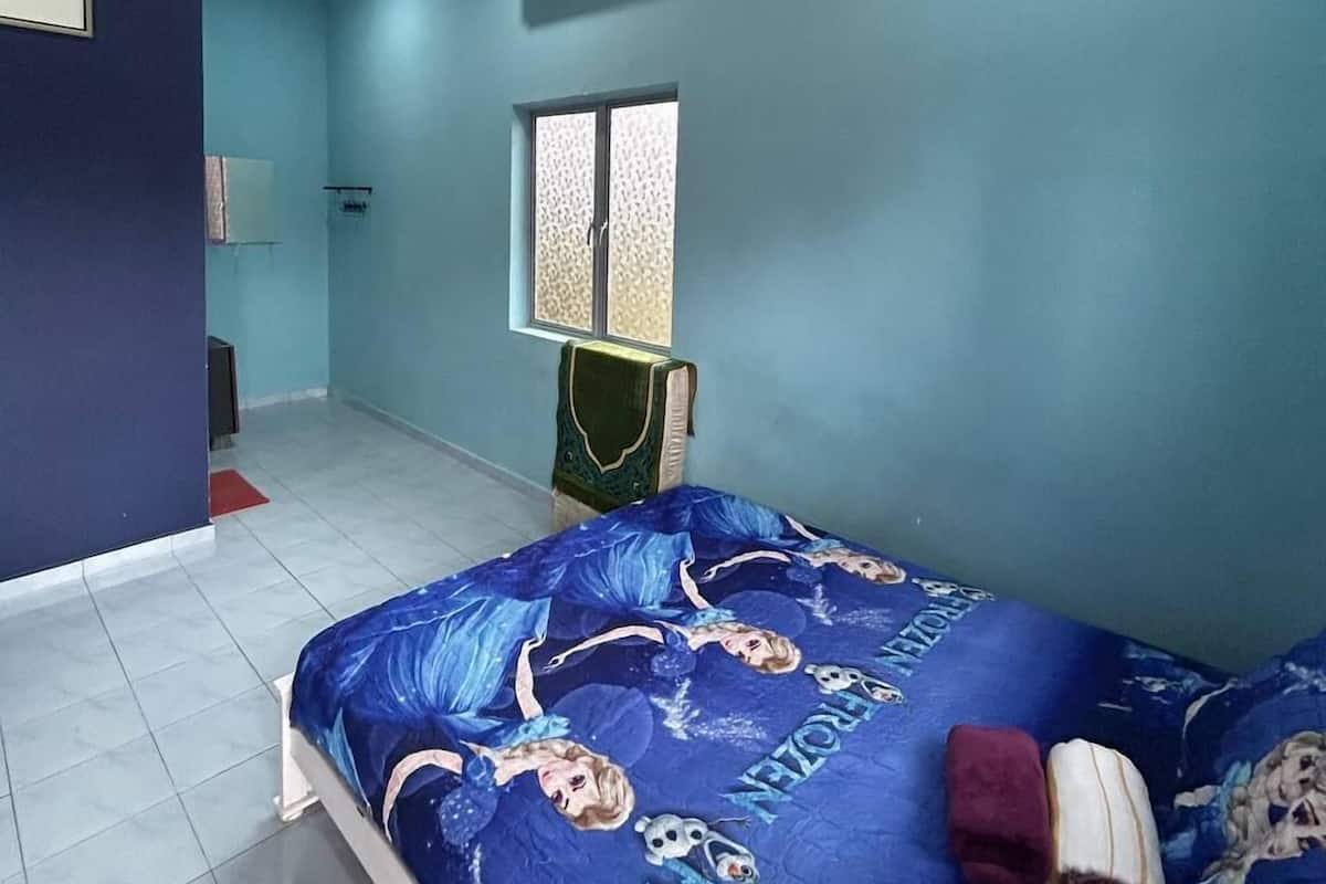 A bedroom with a bed featuring a Frozen-themed bedspread, a ceiling fan, an air conditioning unit, and a window with patterned curtains.