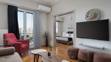 Apartment, Balcony | Living room | 50-inch flat-screen TV with satellite channels