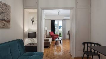 Apartment, Balcony | Living area | 50-inch flat-screen TV with satellite channels