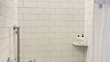 Shower, hair dryer, towels, shampoo