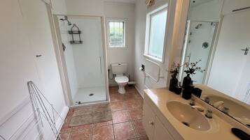 Shower, towels, soap, toilet paper