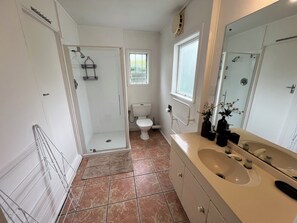 Shower, towels, soap, toilet paper