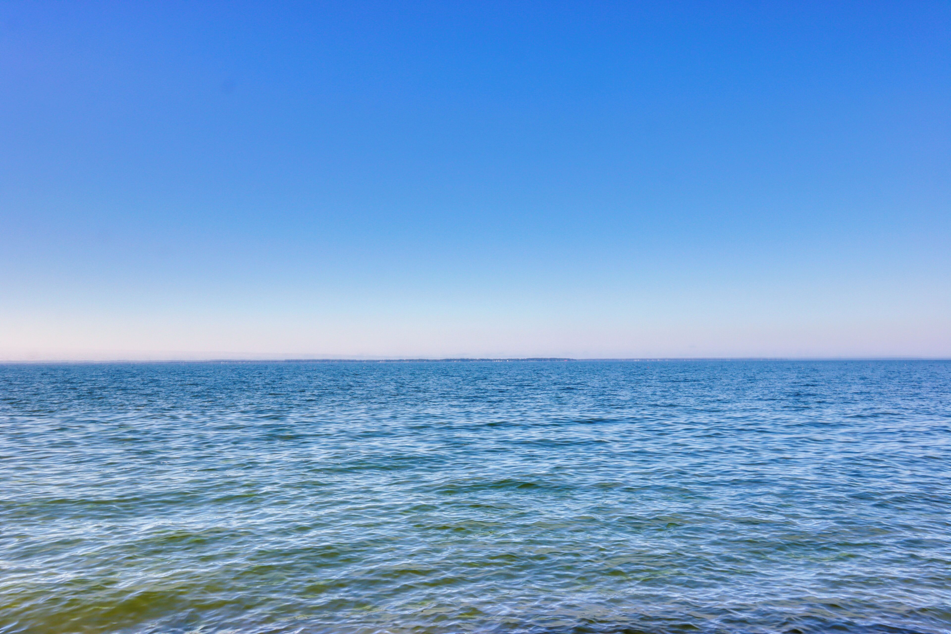A calm sea under a clear sky.