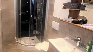 Shower, free toiletries, hair dryer, towels