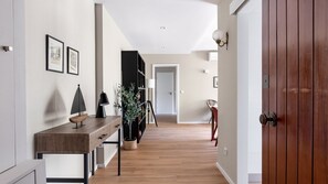 Enter a welcoming space with a console table, lamp, and framed artwork.