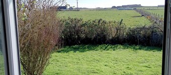 Comfortable three bedroom bungalow located in Orkney Islands complete with emus.