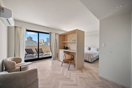 Superior Studio Suite, City View | Premium bedding, minibar, in-room safe, desk