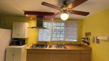 Fridge, microwave, stovetop, coffee/tea maker