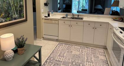 Charming first floor, end unit condo in The Preserve at Woods Edge
