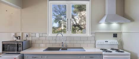 Fridge, microwave, toaster, cookware/dishes/utensils