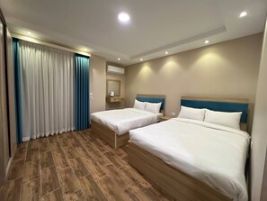 Deluxe Family Room With Balcony | Egyptian cotton sheets, premium bedding, minibar, desk - EQama Grand Egyptian Museum View (Giza)
