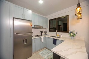 Fridge, microwave, cookware/dishes/utensils