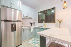 Fridge, microwave, cookware/dishes/utensils