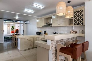 Fridge, microwave, stovetop, cookware/dishes/utensils