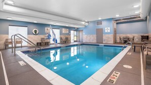An indoor swimming pool with clear water, a lifeguard chair, and a sign indicating no diving. - Holiday Inn Express & Suites Cedar Rapids NE – Marion by IHG (Marion)