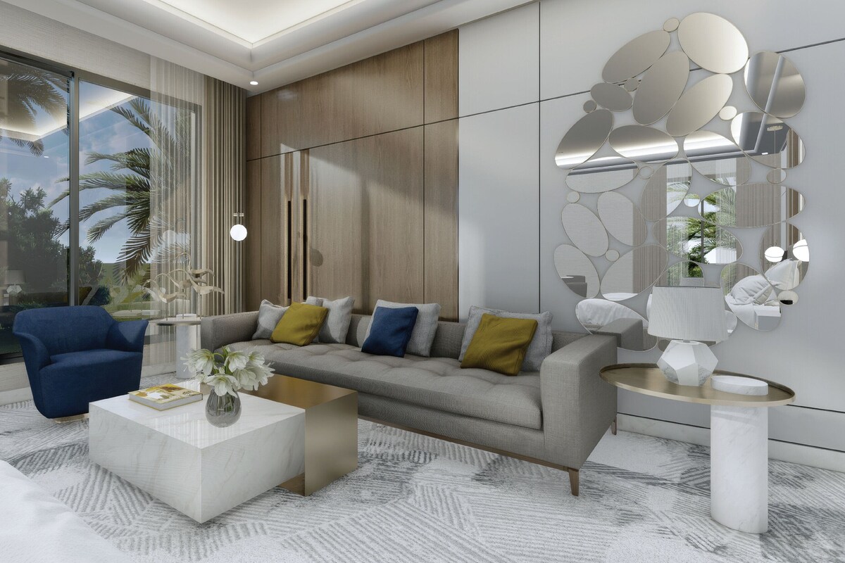 A modern living room with a sofa, coffee table, and decorative wall art.
