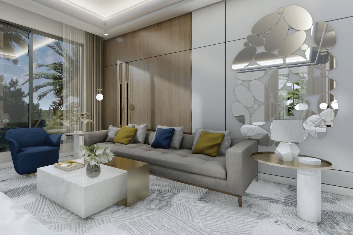A modern living room with a sofa, coffee table, and decorative wall art.