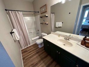 A bathroom with a shower, toilet, and sink. - Upgraded! Quiet Southern Dunes Condo (Haines City)