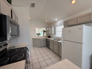 House, Multiple Beds, Pool Access, Pool View | Private kitchen