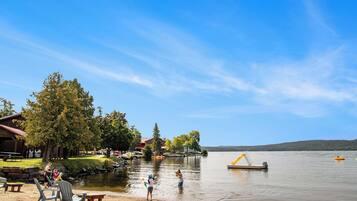 Guests can enjoy serene lakeside views from the comfort of their cabin or lodge.