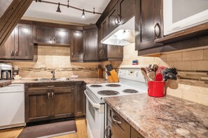 Fridge, microwave, oven, stovetop - Charming 2-Bedroom Suite w/ Hot Tub & Ski in/Out – Perfect for Families & Groups (Vernon)