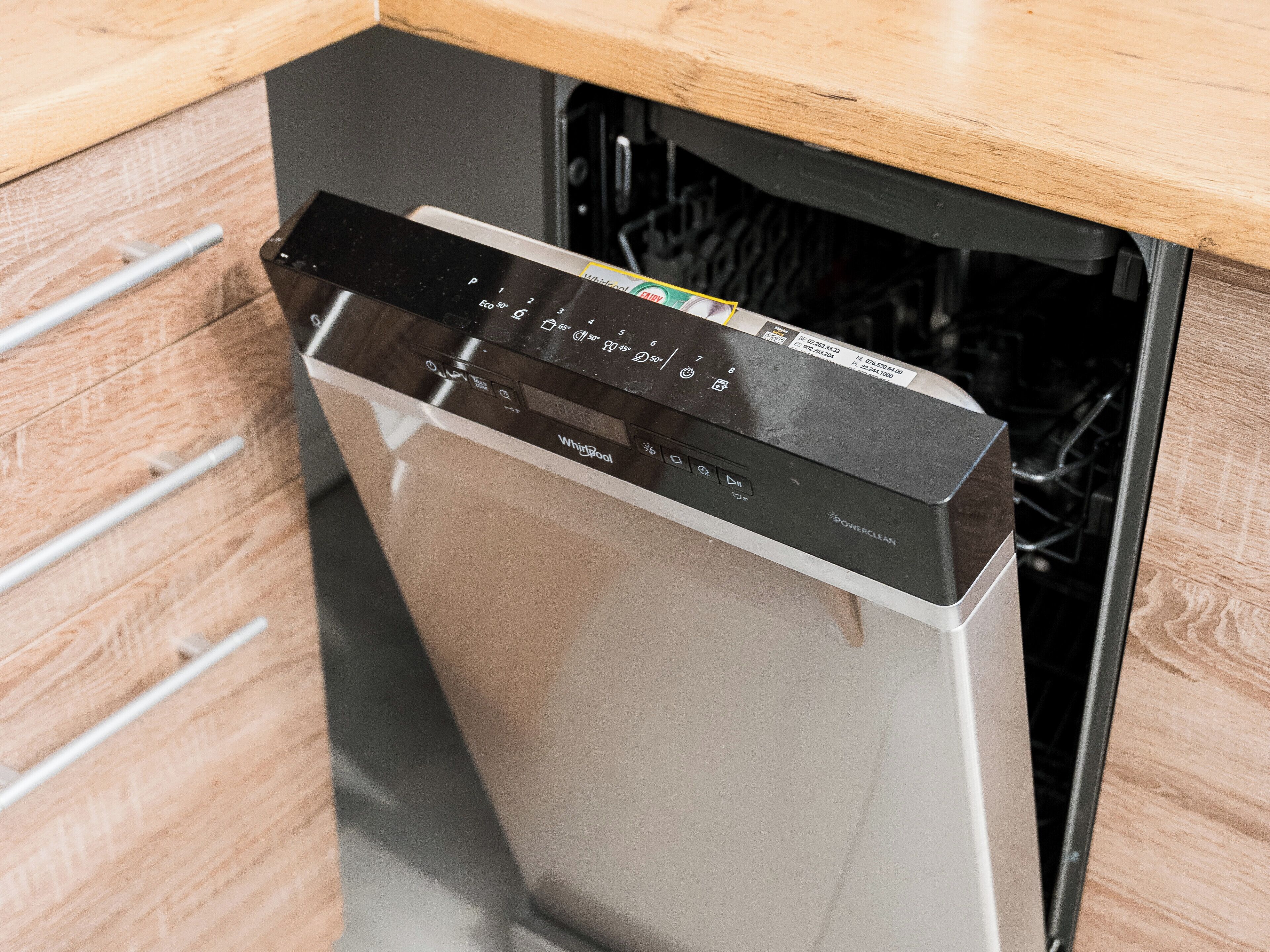 A modern kitchen with a built-in dishwasher.