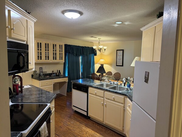 Enjoy cooking in this classic kitchen with microwave, dishwasher, and double sink.