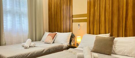 Basic Quadruple Room, 2 Double Beds, Private Bathroom, Garden View | Soundproofing, free WiFi