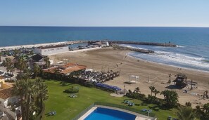 A coastal hotel with a beach, a pool, and a marina. - Apartment 'Mi Patio, Port Of Cabopino' with Shared Pool, Wi-Fi and Air Conditioning (Unknown)