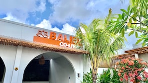 A building with a sign reading "BALENCIAGA CO.LIVE". - Baliem Boutique Hotel Ungasan (Jimbaran)