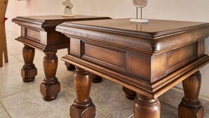 A wooden table with a decorative bird figure on top. - Green Valley Park Stárkov 1 by Interhome (Stárkov)