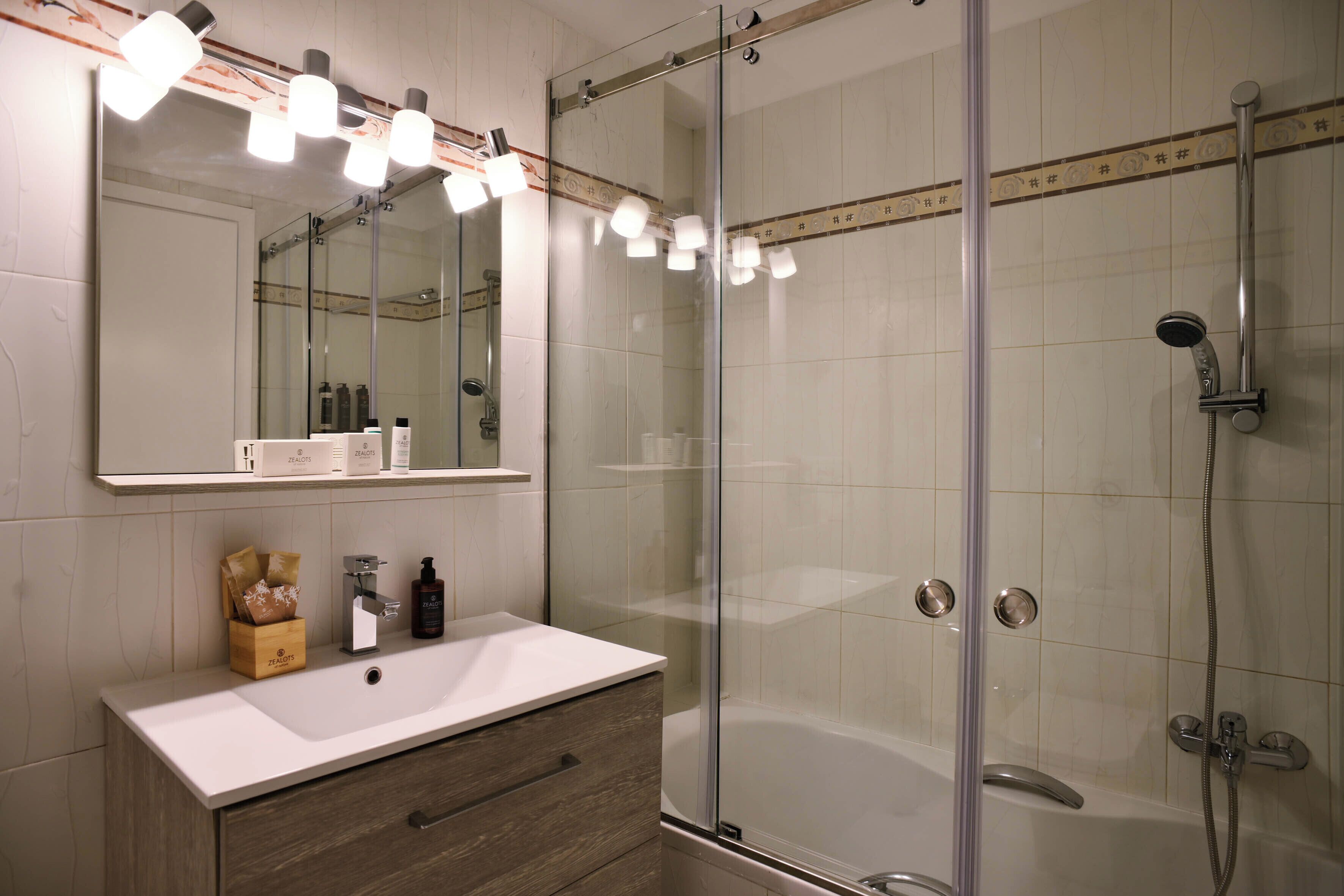 Comfort Apartment | Bathroom | Deep-soaking bathtub, hydromassage showerhead, designer toiletries