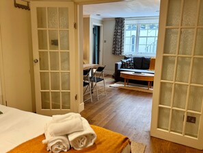 1 bedroom, desk, iron/ironing board, travel crib