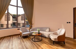 Classic Double Room, Balcony, Pool View | Living area | TV - The Qualia Resort Club & Brewery (Udaipur)