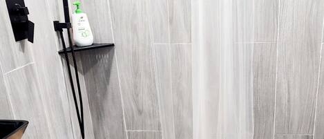 Shower, hair dryer, towels, soap