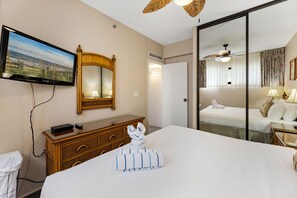 Relax in comfort with a large bed, flat-screen TV, and dresser.