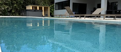 Outdoor pool, open 7:00 AM to 8:00 PM, pool umbrellas, sun loungers
