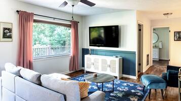 Smart TV, fireplace, books, music library