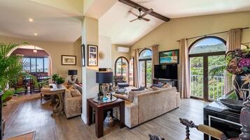 Villa | Living area | TV, fireplace