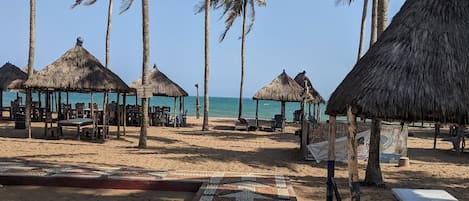 On the beach, sun-loungers