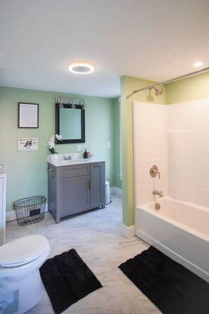 Shower, towels, soap, toilet paper