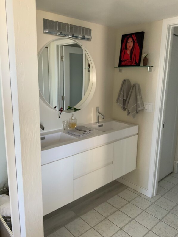 Shower, hair dryer, towels, toilet paper