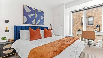 1 bedroom, desk, iron/ironing board, travel crib