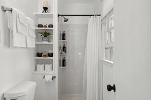 Shower, hair dryer, towels, soap