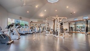 A gym with treadmills, elliptical machines, and weightlifting equipment. - Las Mañanitas LM C209 (Los Cabos)