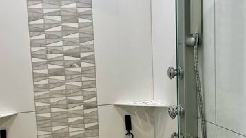 Shower, hair dryer, towels, soap